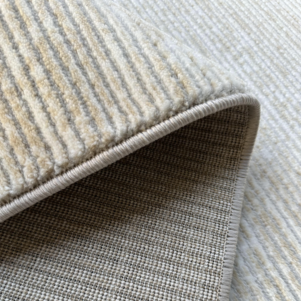 Textured Oberon Stripes washable rug in soft neutral shades.