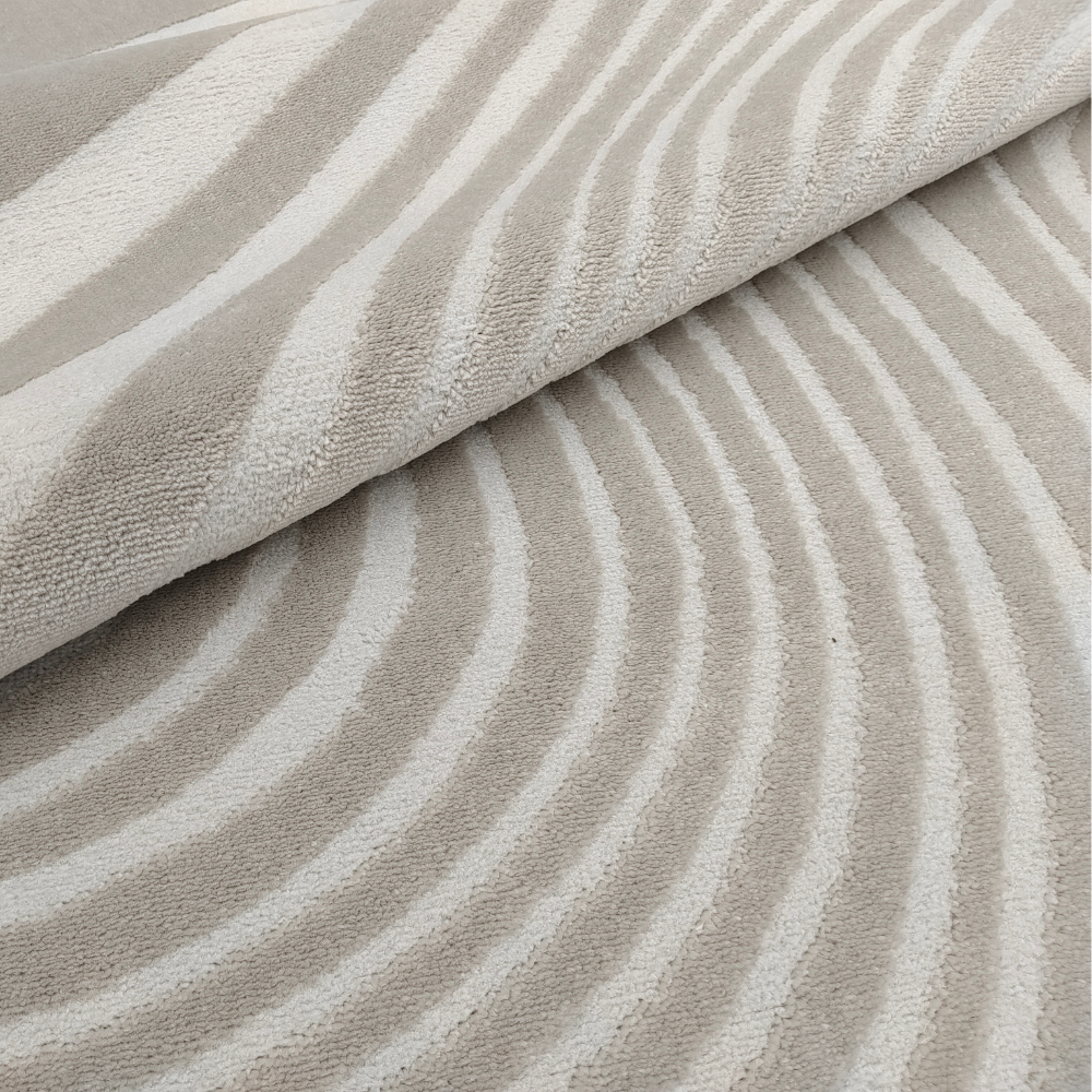 Beige textured rug with elegant wavy lines for contemporary living spaces.