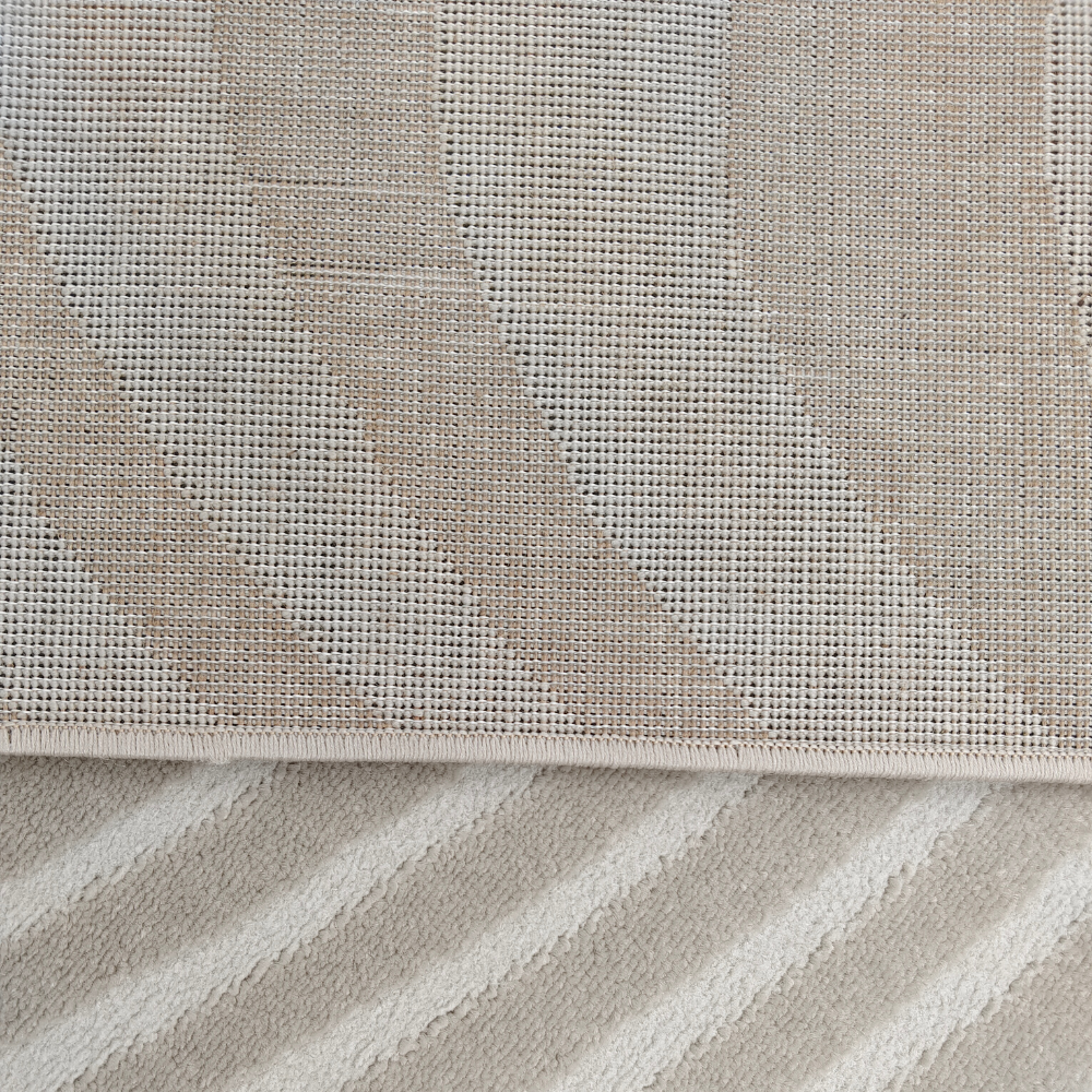 Beige textured rug with wavy patterns perfect for modern home decor.