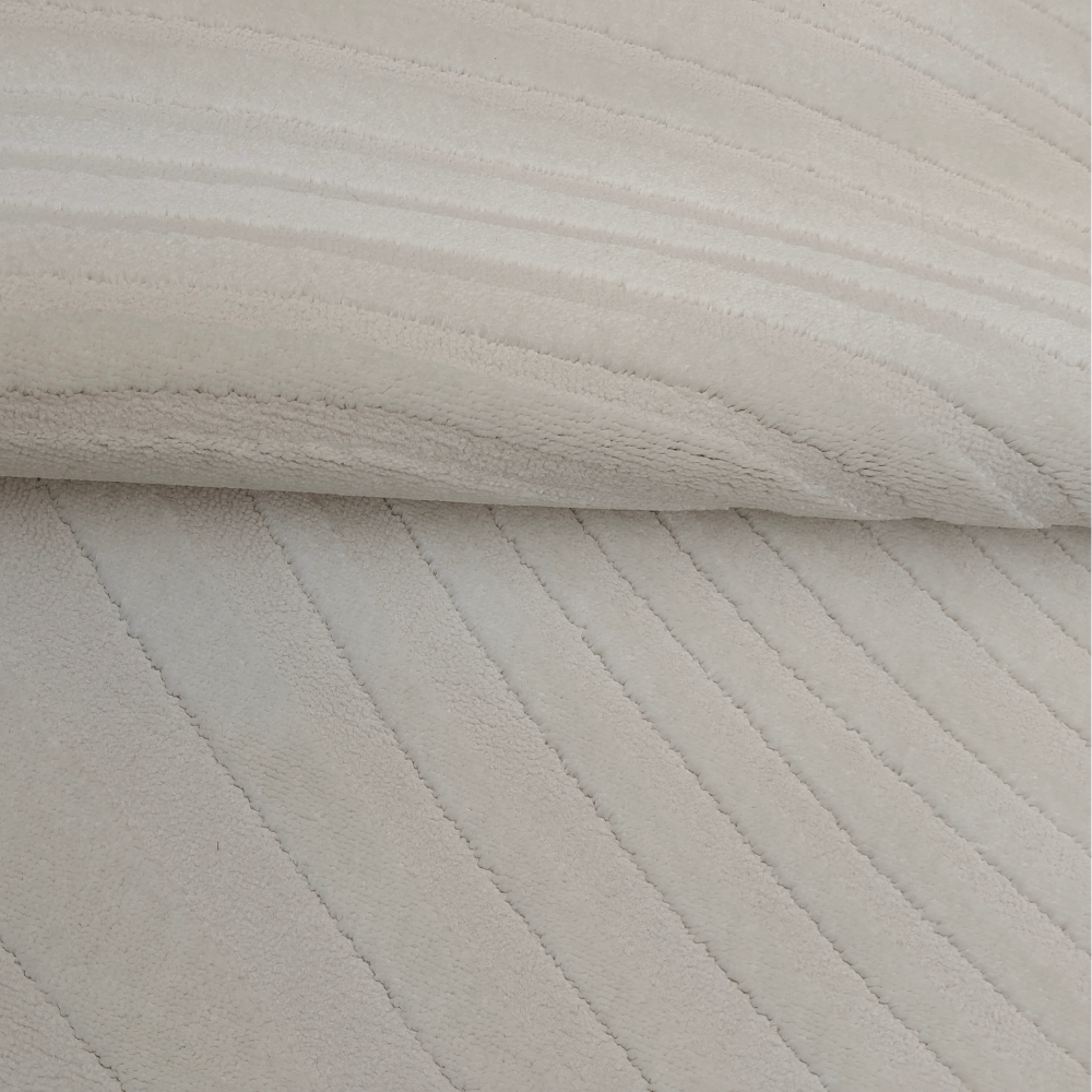 Beige textured rug with soft wave lines, perfect for stylish home interiors.