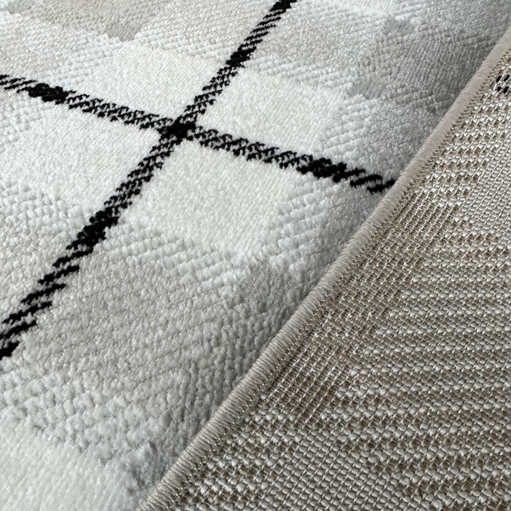 Lucian Checkered Textured Rug detail in soft neutral colors with geometric pattern.