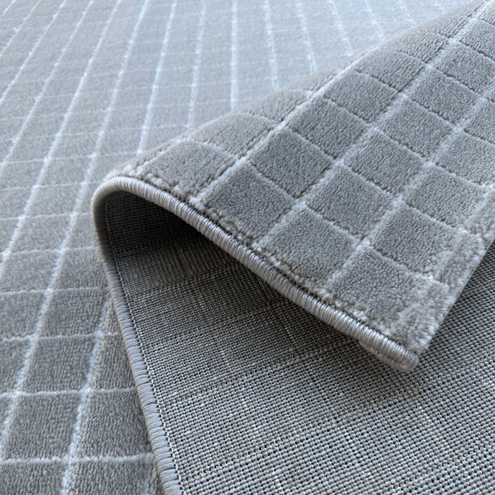 Gray Zinnia geometric rug with grid design, highlighting soft texture.