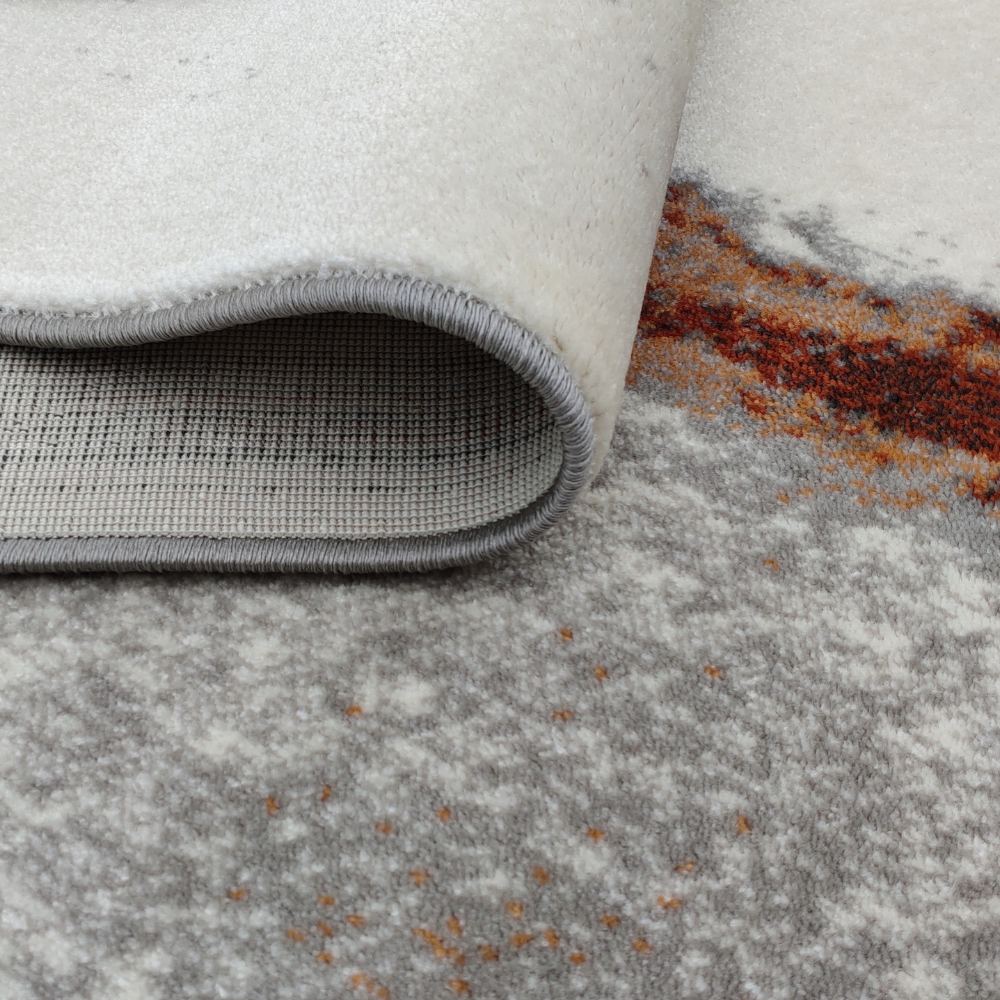 Iris Abstract Textured Rug featuring gray and rust tones, perfect for modern decor.