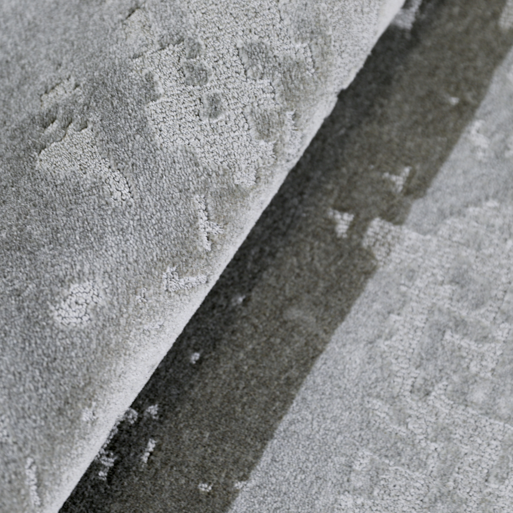 Light gray textured woven rug ideal for contemporary home decor.