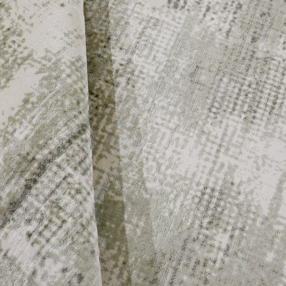 Soft gray and beige blended woven rug with a textured design.