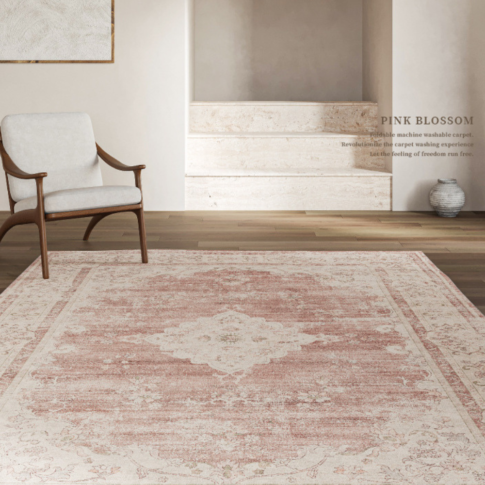 Vintage pink and cream floral rug enhancing a cozy living space