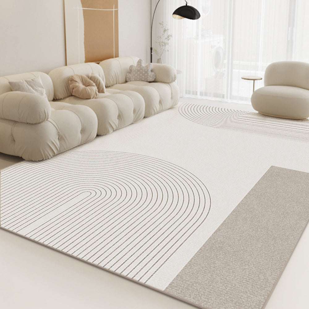 Beige rug with curved lines in a contemporary living room setting