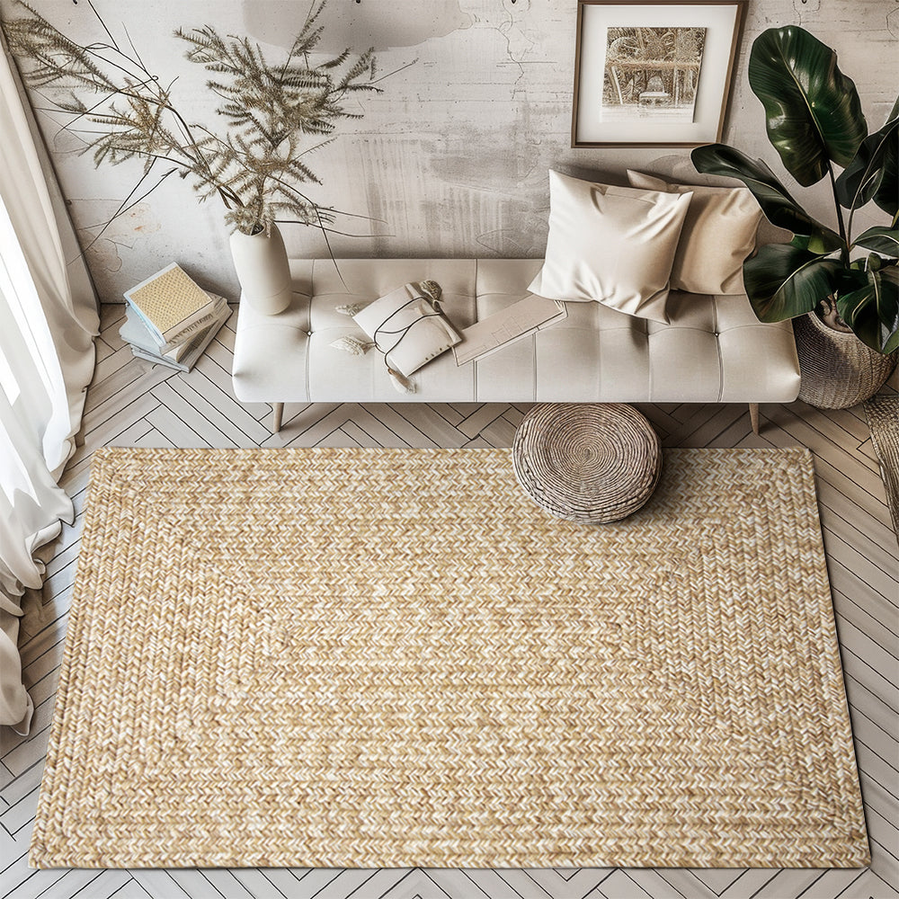 Beige Liam hand-braided outdoor rug on stylish floor, customizable size available.