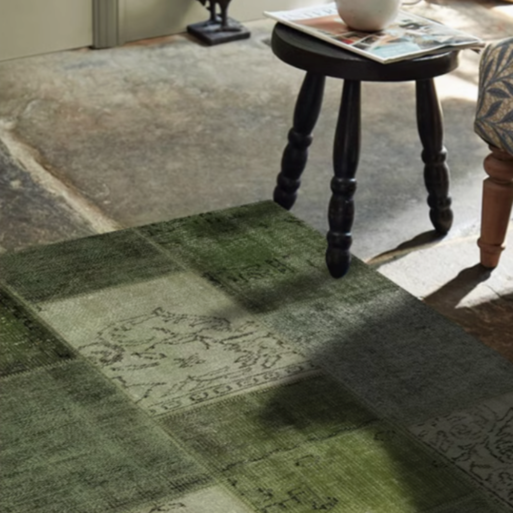 Geometric green washable rug in a cozy living room environment