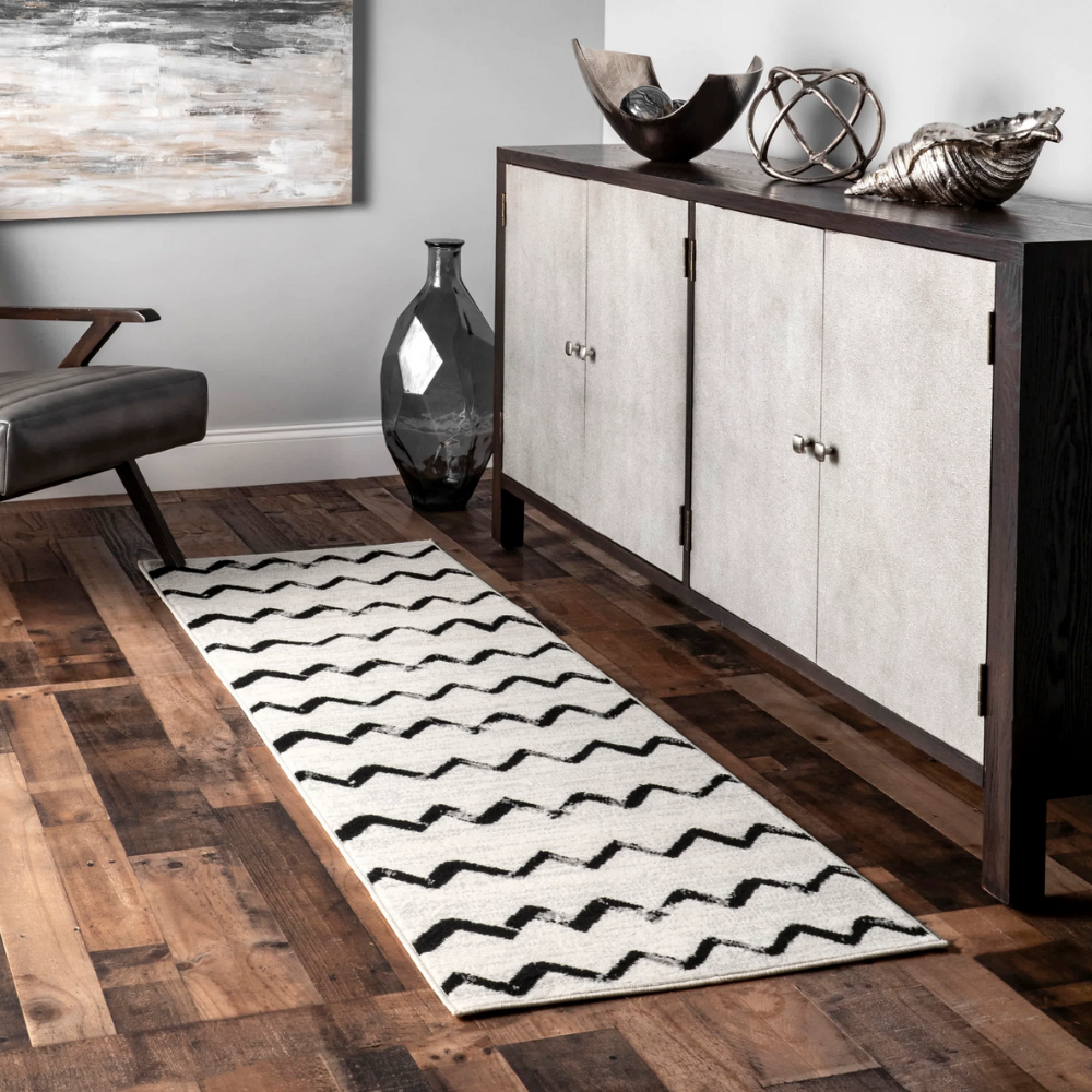 Nerissa Waves washable rug with black zigzag pattern in modern living room