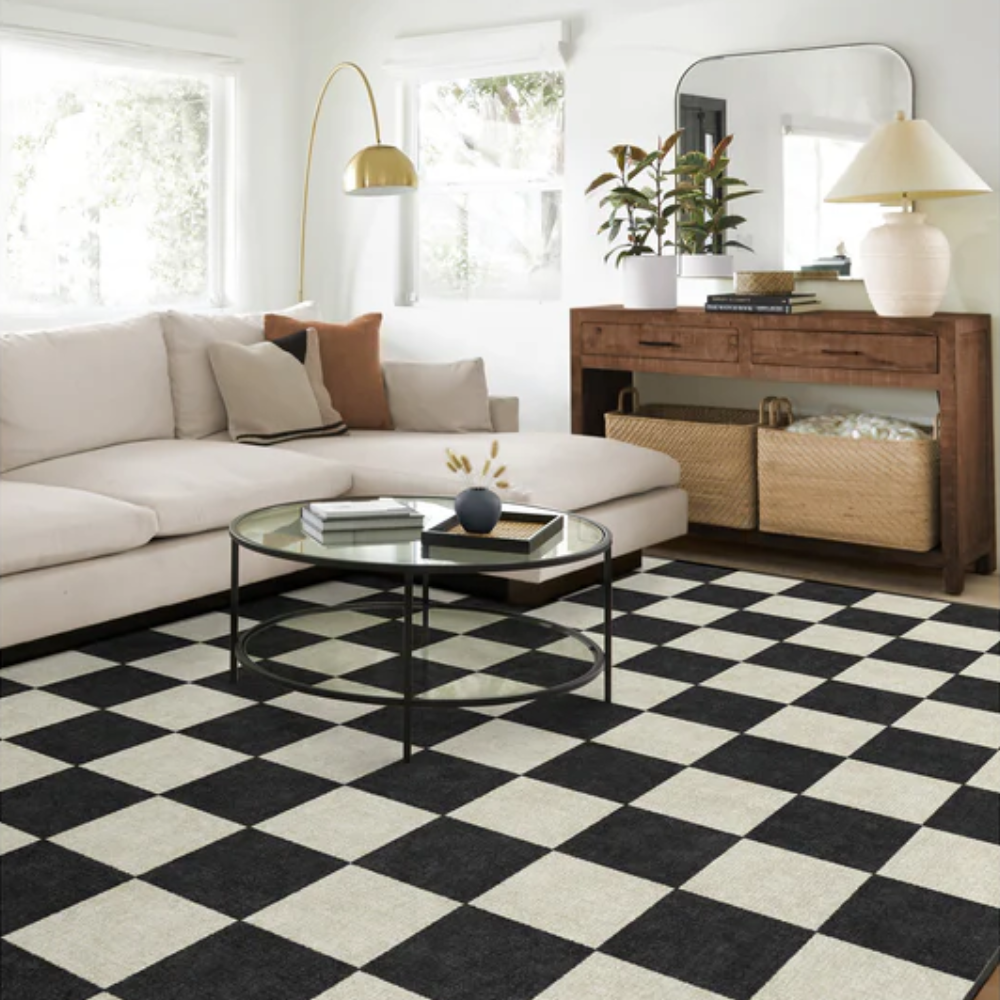 Modern living room with Calypso checkered washable rug in black and beige.
