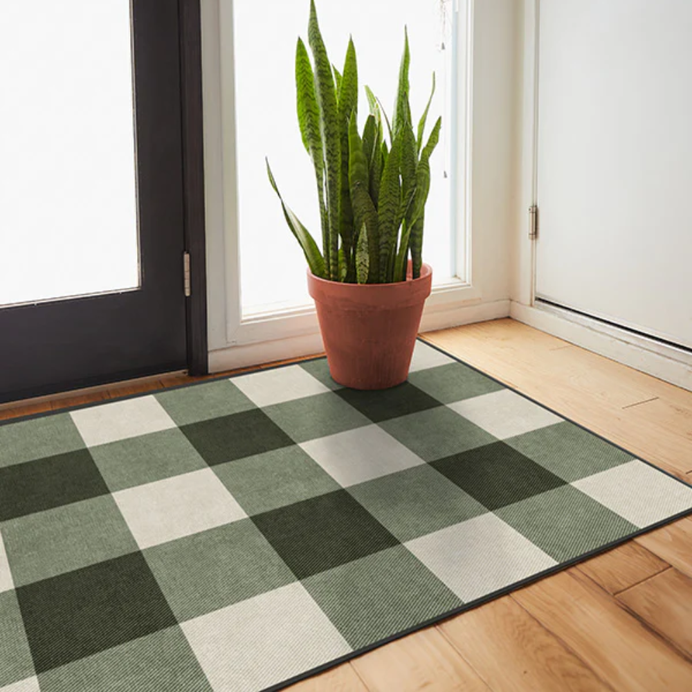 Green and beige checkered washable rug by Rugsway with indoor plant
