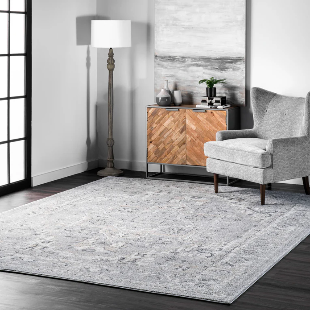 Elegant gray and cream Evander Persian washable rug in modern living room.