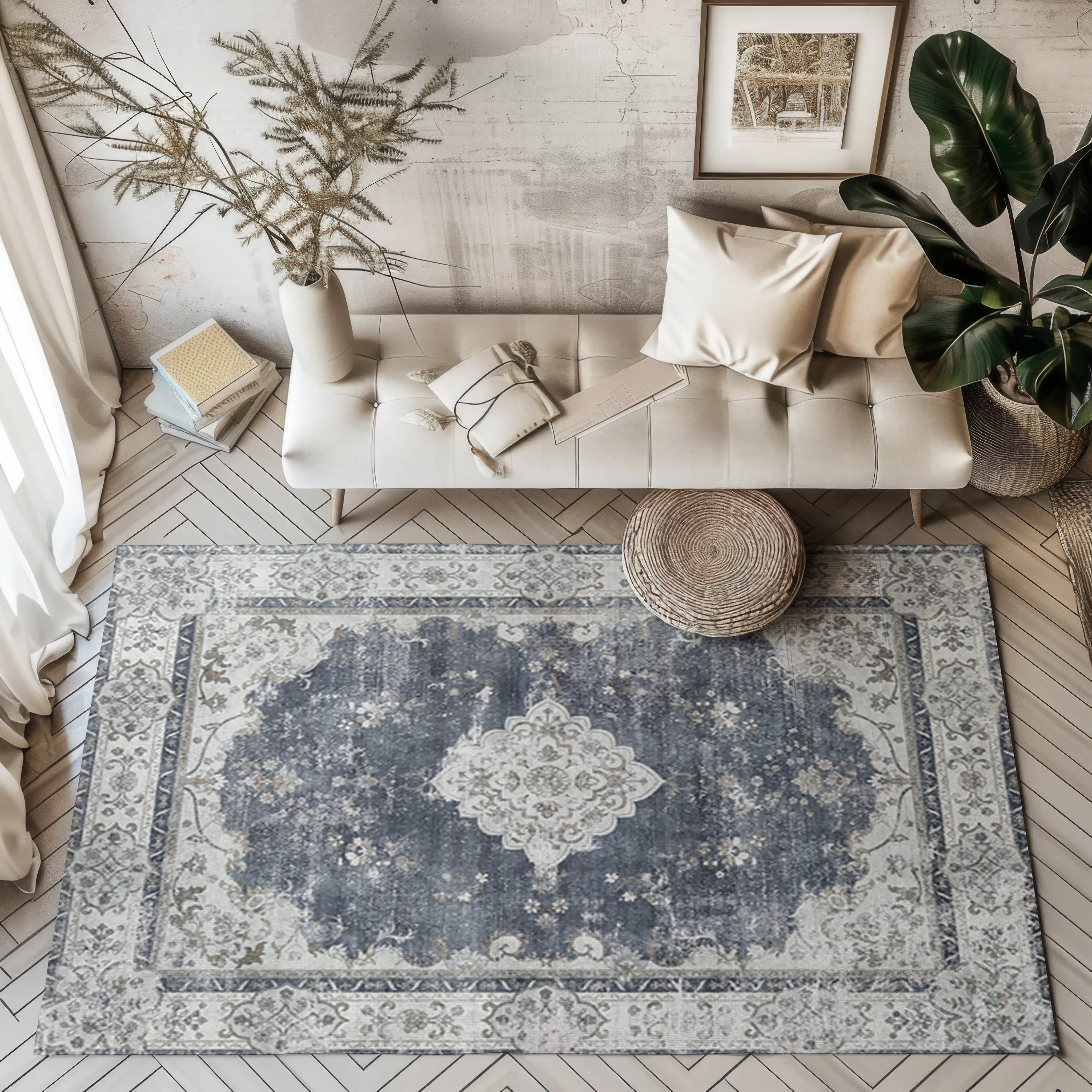 Navy blue vintage rug with floral design in modern living room setting