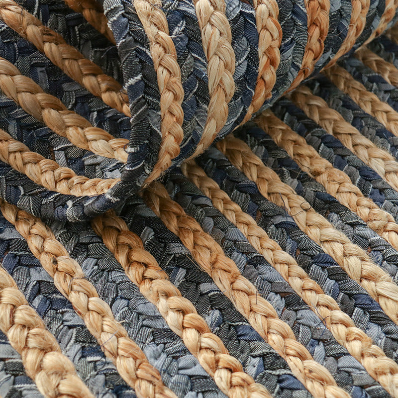 Close-up of Eternal Waves vintage woven rug with braided stripes in natural colors.