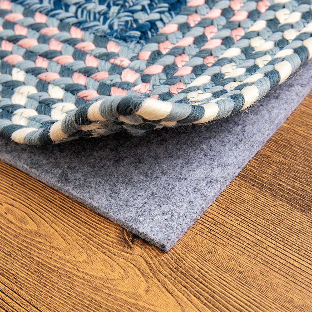 Braided Starlit Horizon Stria outdoor rug detail with blue, pink, and cream colors.