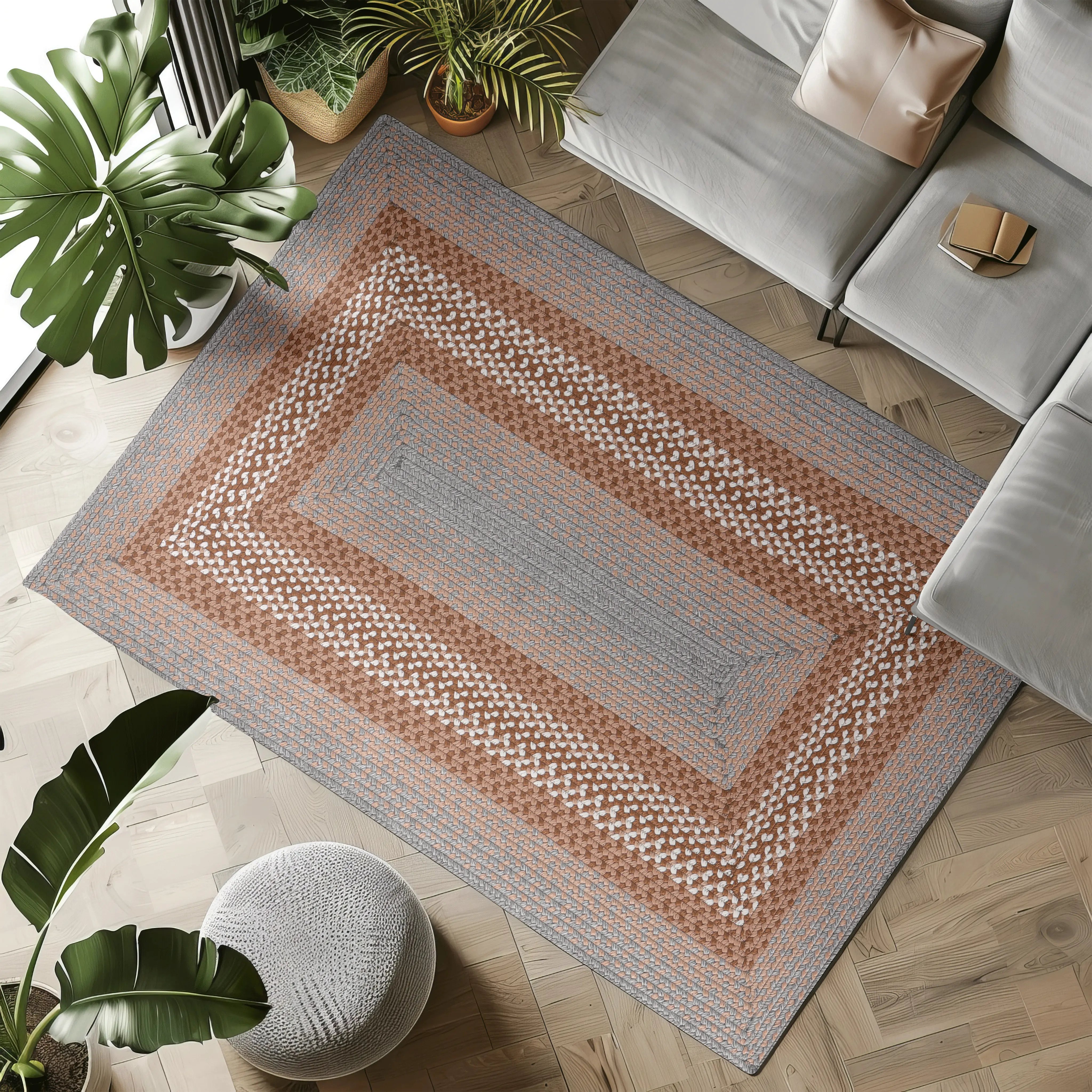 Geometric patterned hand-woven outdoor rug in gray and brown tones