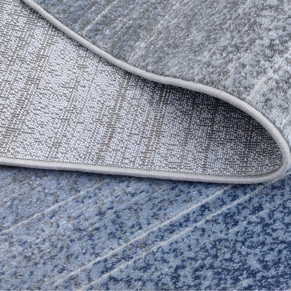 Soft blue and silver abstract rug, ideal for contemporary home decor.