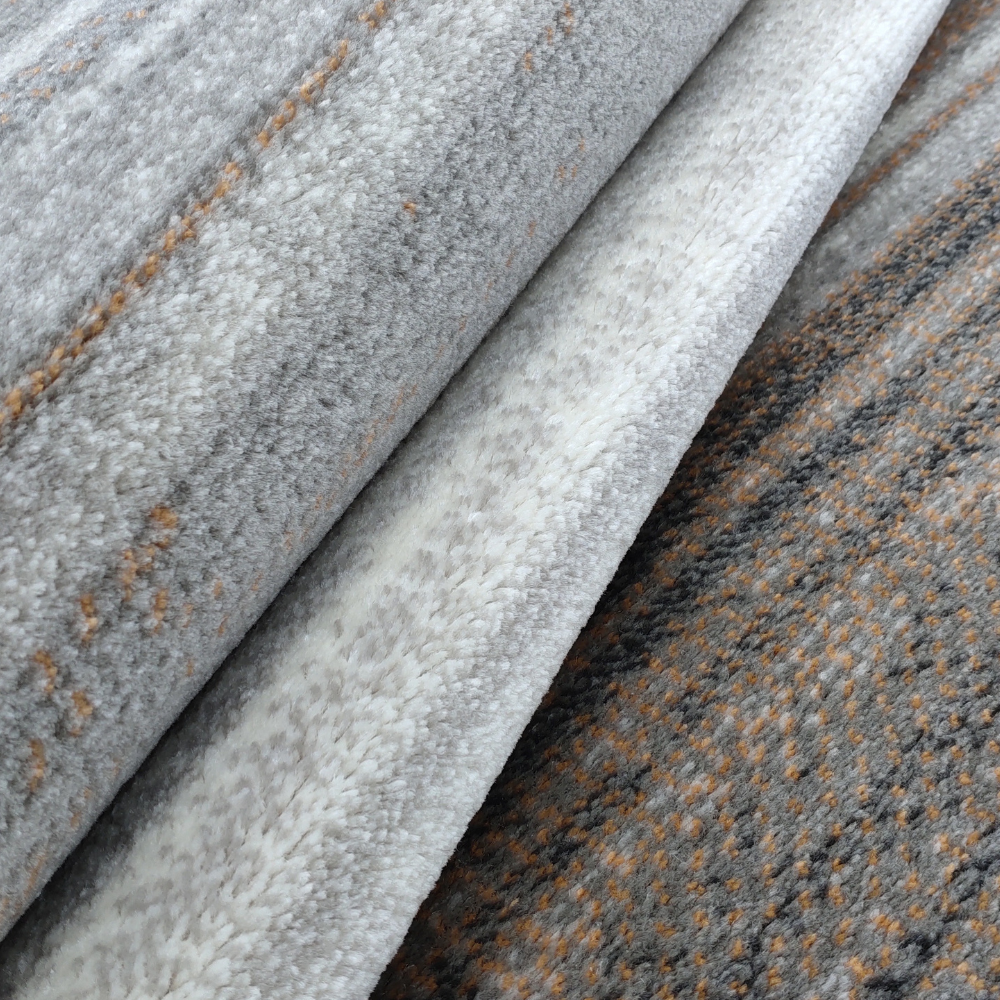Bastian Abstract Textured Rug in gray and brown, suitable for contemporary home styles.