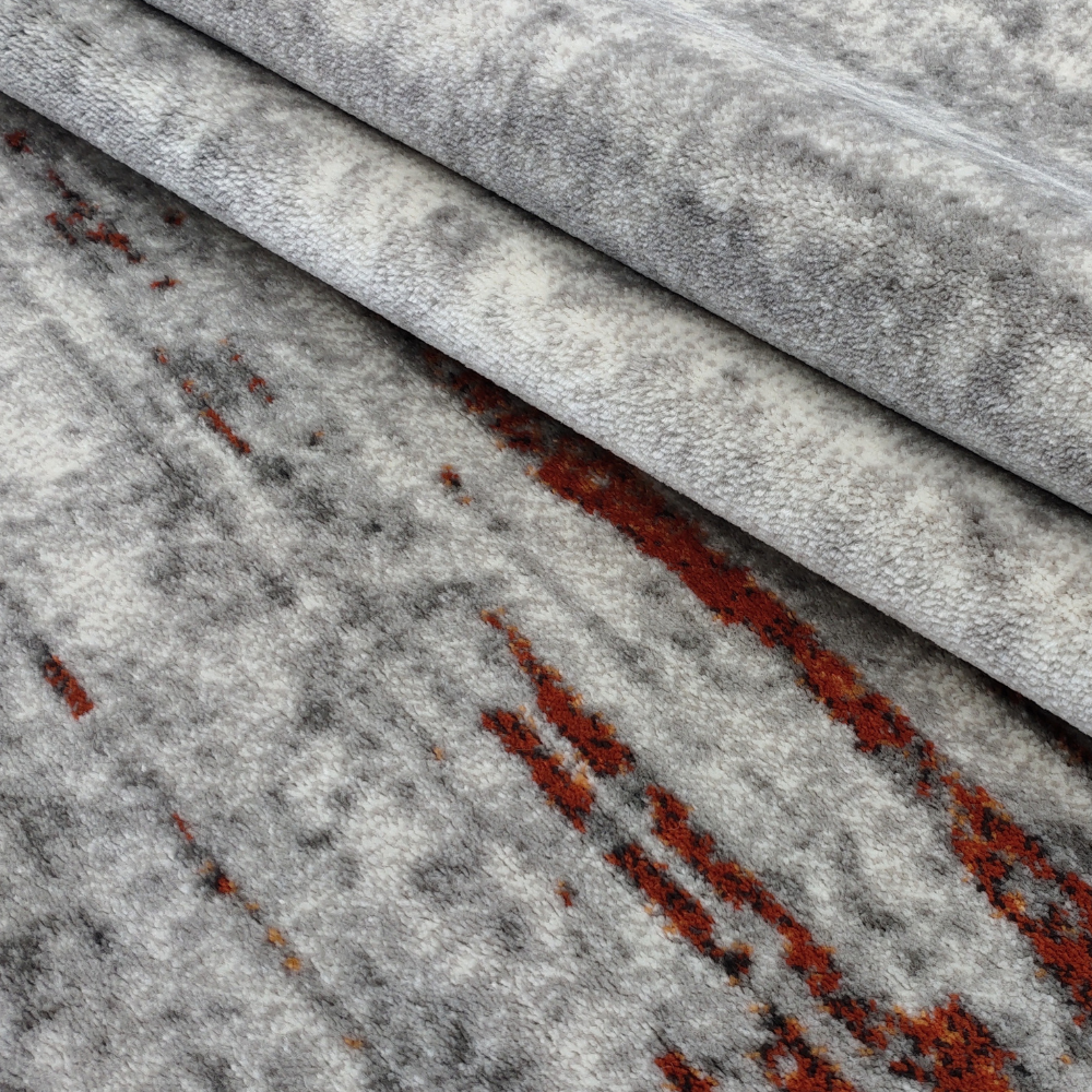 Aurelia Abstract Textured Rug with gray and orange abstract design