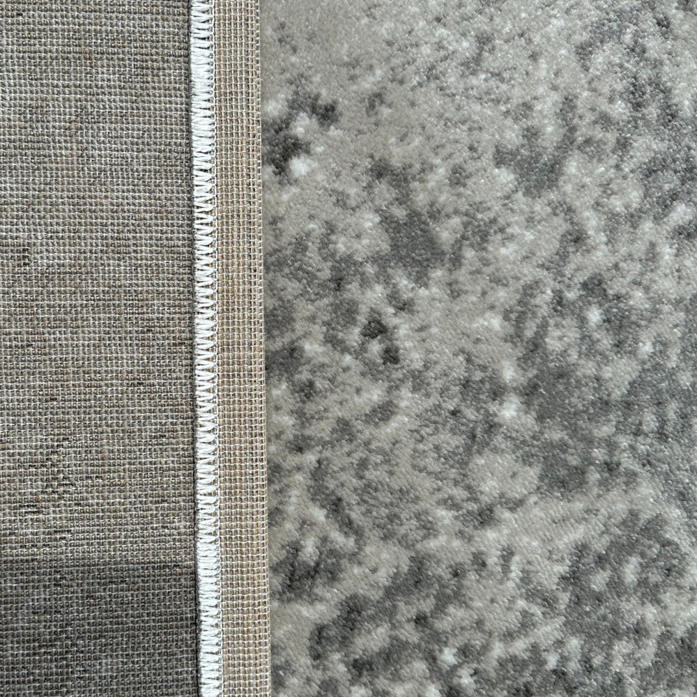 Ansel Abstract Textured Rug in gray, ideal for contemporary interior design.