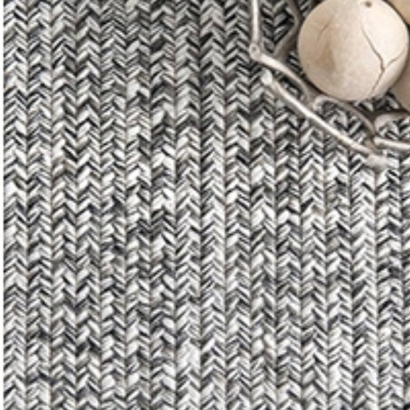 Gray striped Winter Woven Textured Rug with tussles, perfect for stylish outdoor decor.